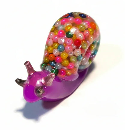**Handcrafted Bright Violet Multicolor Beaded Resin Snail Figurine - Rainbow "Gumball" Maximalist Decor | Whimsical Artisan Desk Pet by Crazy Chaotic Crafter**